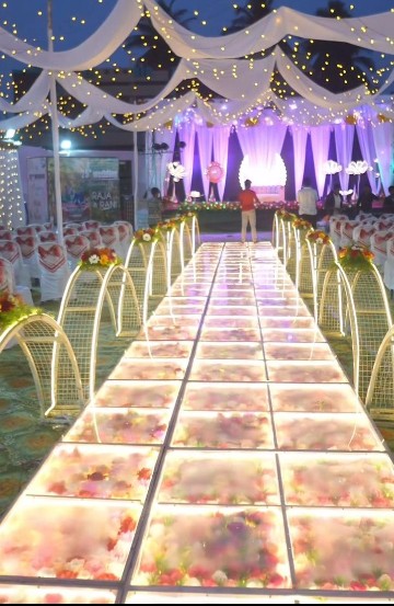 Artificial flowers, decorative ornaments, and wedding décor displayed in a decoration wholesale showroom in Ahmedabad.